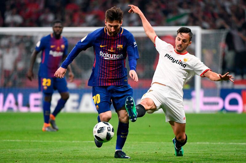 Barcelona's Lionel Messi, left, vies with Sevilla midfielder Pablo Sarabia during their Copa del Rey final at the Wanda Metropolitano stadium in Madrid. Pierre-Philippe Marcou / AFP