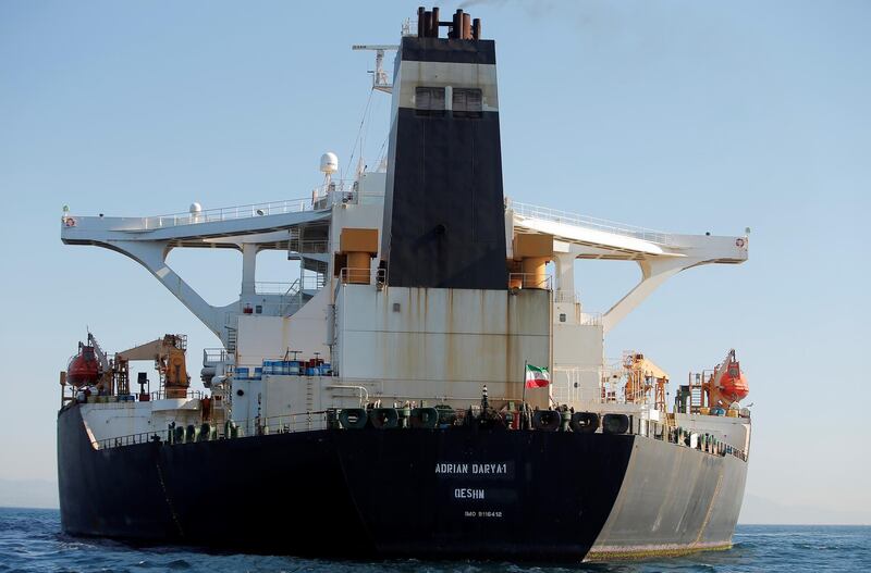 An Iranian flag flies at Iranian oil tanker Adrian Darya 1, before being named as Grace 1, as it sits anchored after the Supreme Court of the British territory lifted its detention order, in the Strait of Gibraltar, Spain, August 18, 2019. REUTERS/Jon Nazca