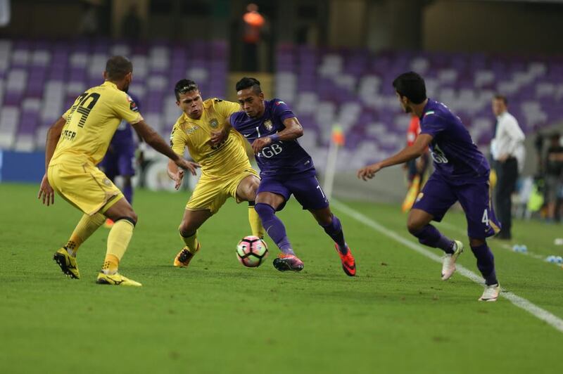 Caio of Al Ain, centre, in action against Al Wasl on Sunday night in the Arabian Gulf League. Photo Courtesy / Aletihad / December 4, 2016