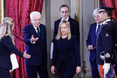 Italian President Sergio Mattarella, second left, welcomes new Prime Minister Giorgia Meloni as she arrives for the swearing-in ceremony. AFP