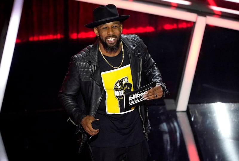 FILE - Stephen "tWitch" Boss presents the award for top Latin artist at the Billboard Music Awards in Los Angeles on Oct.  14, 2020.  (AP Photo / Chris Pizzello, File)