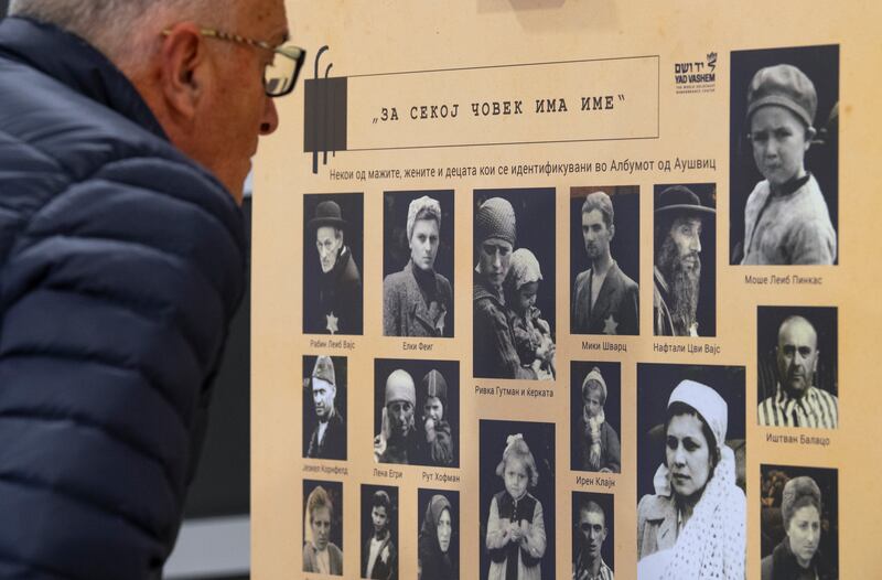 A visitor views an exhibition of documentary photographs from Auschwitz at the Holocaust Museum in Skopje, North Macedonia. EPA 