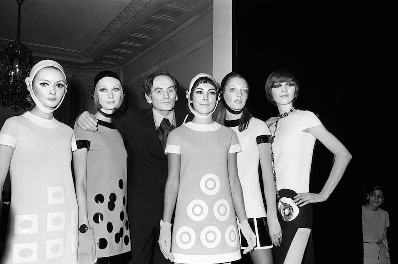 Pierre Cardin flanked by models after his spring /summer show in Paris in January 1967. AFP
