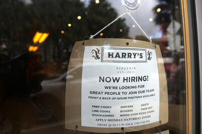 FILE - In this Nov. 6, 2019, file photo a sign advertises job opportunities at Harry's Pizzeria in the Coconut Grove neighborhood in Miami. Economists predict hiring in the U.S. rebounded in November after falling the previous month. On Friday, Dec. 6, the government issues the November jobs report. (AP Photo/Lynne Sladky, File)