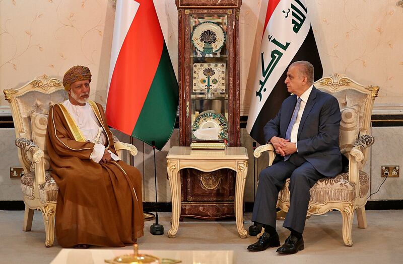 Iraqi Foreign Minister Mohamed Alhahkim, right, meets his visiting Omani counterpart Yusuf bin Alawi at the Ministry of Foreign Affairs Building in Baghdad. AP Photo