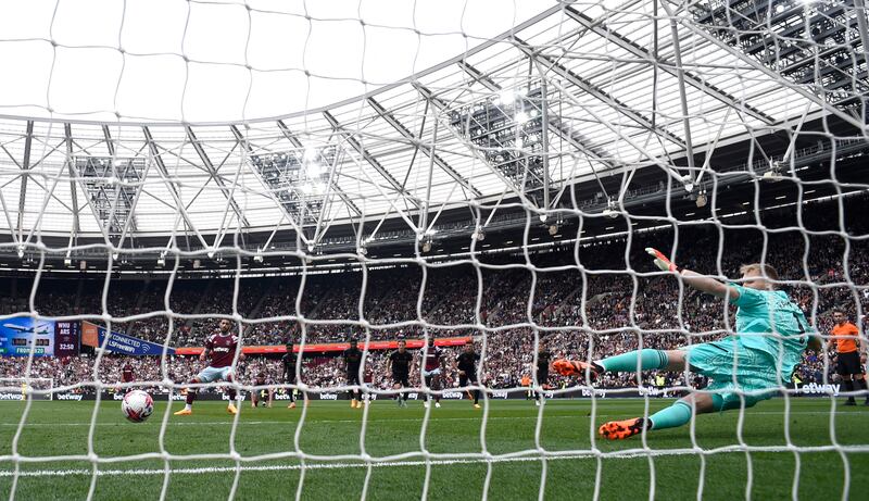 West Ham United's Said Benrahma scores their first goal from the penalty spot to make it 2-1 to Arsenal. Reuters