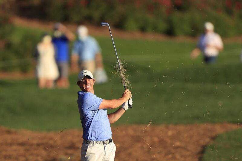 McIlroy plays a shot on the 18th hole. AFP