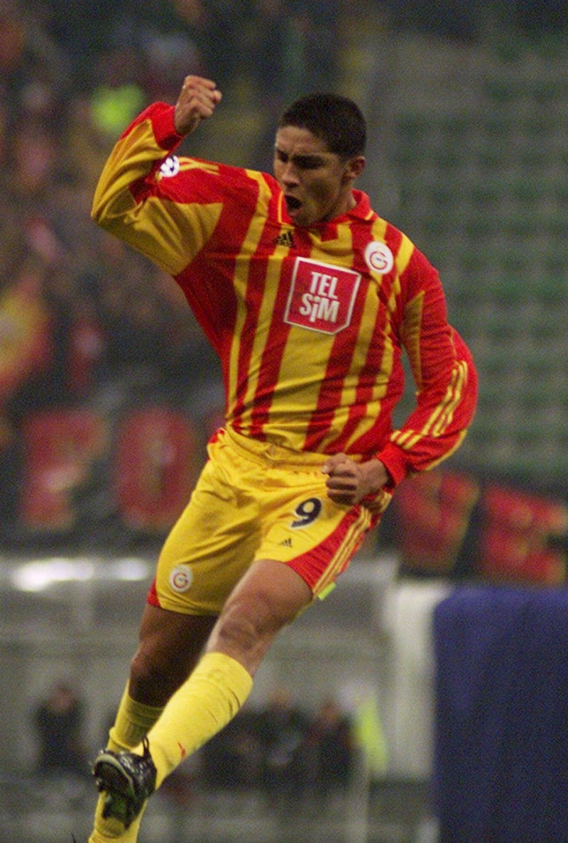Galatasaray's Mario Jardel, of Brazil, celebrates after scoring  during the Group B, Champions League match between AC Milan and Galatasaray at the San Siro stadium in Milan, Italy, Tuesday, Nov. 21, 2000.  (AP Photo/Luca Bruno)
