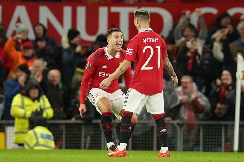 Antony, right, celebrates with Diogo Dalot. AP