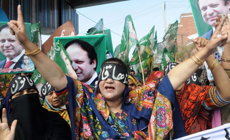 epaselect epa06560605 Supporters of former Prime Minister Nawaz Sharif wear headbands reading in Urdu 'Blind Justice' during a protest after the Supreme Court barred him from leading the ruling Pakistan Muslim League Nawaz, in Multan, Pakistan, 24 February 2018. The Supreme Court of Pakistan announced on 21 February the verdict it reserved on Election Act 2017, declaring former prime minister Nawaz Sharif ineligible to head his own party, Pakistan Muslim League-Nawaz (PML-N). Nawaz Sharif and his sons are inducted in corruption references, after the National Accountability Bureau, an anti-corruption body, opened three cases, related to ownership of property at an exclusive zone in London; the creation of the firms Azizia Steel and Hill Metal; and the Flagship investment firm, as well as another 15 companies, on the orders of the Supreme Court.  EPA/FAISAL KAREEM