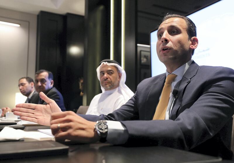 Dubai, United Arab Emirates - August 04, 2019: Mr. Shehab Gargash (M) the Chairman of Daman Investments PSC and Mr. Ali Al Adou (R), Head of Asset Management, Daman Investments. Daman InvestmentsÕ 2019 Annual Media Forum, where the Daman Investments management team will comment on the current and future financial landscape, view of the year ahead and highlights opportunities in 2019-2020, with guidance on the stock-markets and local-global economic trends. Sunday the 4th of August 2019. Waldorf Astoria DIFC, Dubai. Chris Whiteoak / The National
