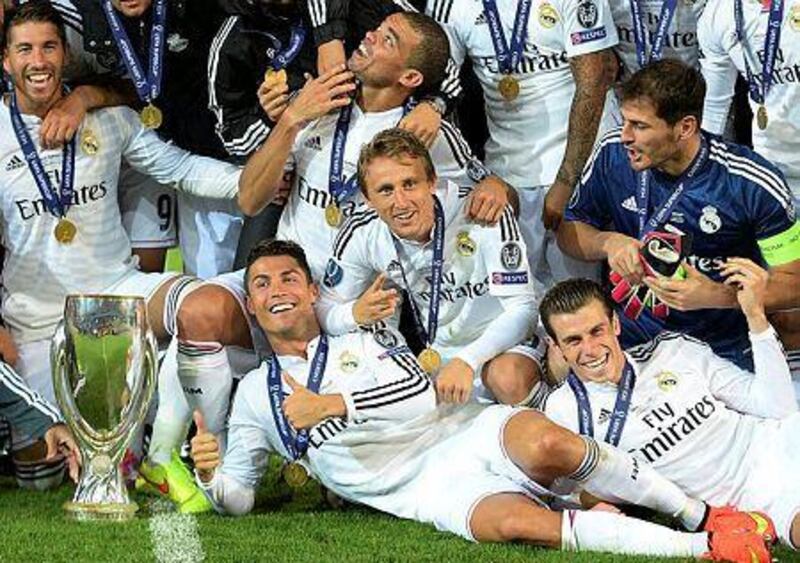 Gareth Bale celebrates with Real Madrid teammates after beating Sevilla in the Uefa Super Cup in Cardiff in 2014. EPA