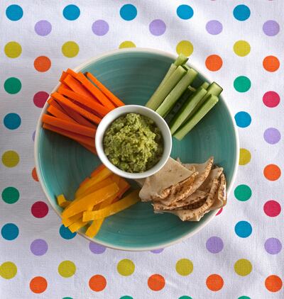 Dubai - May 23, 2011 - A plate of pea hoummus with vegetables and pita bread is a healthy snack for children or anyone in Dubai, May 23, 2011. (Photo by Jeff Topping/The National) 
 