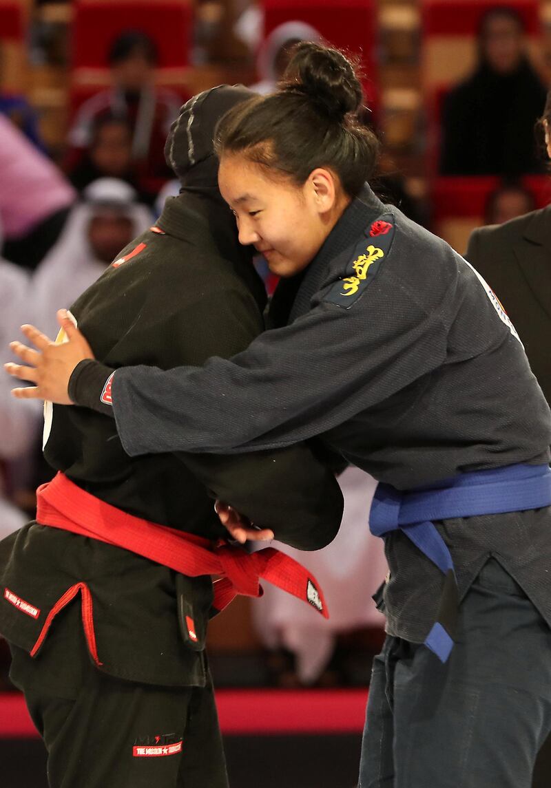 ABU DHABI,  UNITED ARAB EMIRATES , April 21 – 2019 :- Shamsa Gharebi ( red from UAE Al Wahda Club Jiu Jitsu Academy ) vs Khulan Batmunkh ( blue from Khilchin won) during the final of 70kg category   in the Abu Dhabi World Professional Jiu Jitsu  Championship 2019 held at the Mubadala Arena in Abu Dhabi. Khulan blue won the fight. ( Pawan Singh / The National ) For Sports. Story by Amith