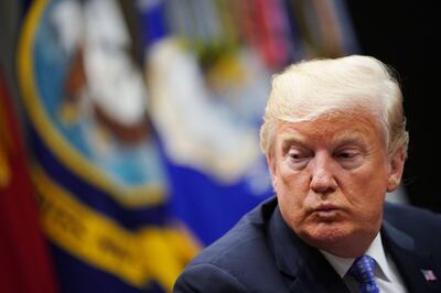 (FILES) In this file photo taken on August 23, 2018 US President Donald Trump speaks during a roundtable discussion on the Foreign Investment Risk Review Modernization Act in the Roosevelt Room of the White House. US President Donald Trump on October 3, 2018 shrugged off a New York Times investigation that concluded he made his fortune with the help of more than $400 million from his parents, partly through tax schemes, as a boring, often-told "hit piece."Trump has often boasted that he built a multi-billion dollar real estate empire from a small loan from his father, Fred, himself a prominent New York builder.
 / AFP / MANDEL NGAN
