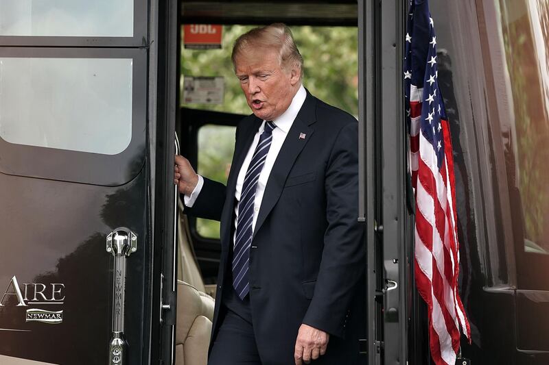U.S. President Donald Trump tours a recreational vehicle manufactured by Newmar Corp. during a "Made in America" products showcase on the South Lawn of the White House in Washington, D.C., U.S., on Monday, July 23, 2018. Trump is considering revoking the security clearances of former FBI Director James Comey, ex-CIA Director John Brennan and other Obama-era national security officials who have criticized him. Photographer: Alex Wong/Pool via Bloomberg