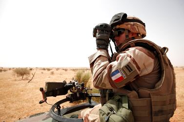 A French soldier uses his binoculars during Operation Barkhane in Inaloglog, Mali. Reuters