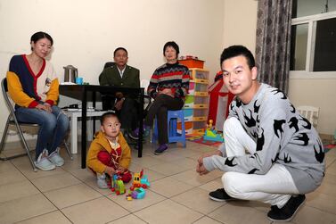 Cheng Shengping (right) with his family Menglan Zhu (wife, left), Changgeng Cheng (father), Rongya Ma (mother) and Qianqian (son) at his flat in International City in Dubai. Pawan Singh /The National