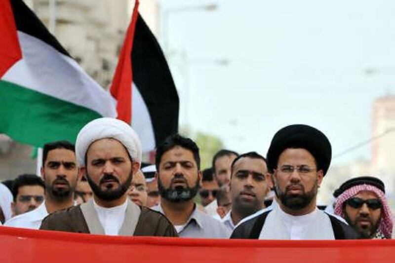 Ayatollah Sheikh Hussein al Najati (left, foreground) has been stripped of his passport in an action taken yesterday.