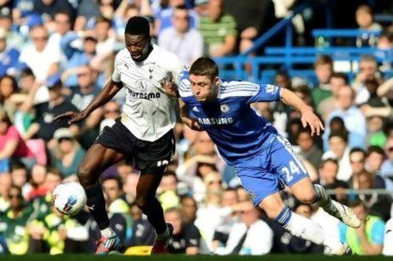 Emmanuel Adebayor, centre, the Tottenham striker, is sandwiched out by Chelsea duo Ramires, left, and Gary Cahill, who was a transfer target for Spurs last summer.