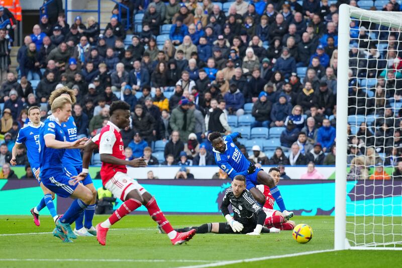 Arsenal's Gabriel Martinelli, right, scores past Leicester's goalkeeper Danny Ward. AP