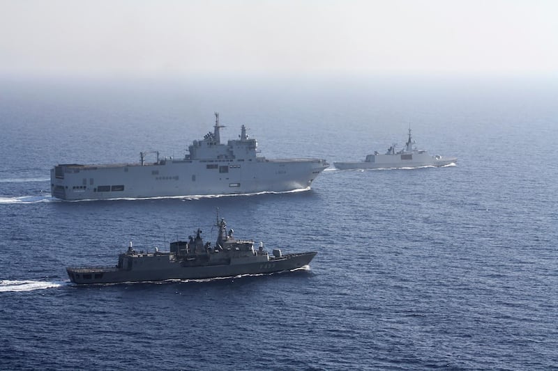 The French Tonnerre helicopter carrier, rear left, is escorted by Greek and French military vessels during a maritime exercise in the Eastern Mediterranean, where Greek and Turkish warships are also closely shadowing each other. (Greek National Defence/AP)