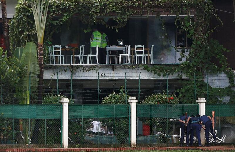Policemen outside the Holey Artisan Bakery after gunmen attacked. Adnan Abidi  / Reuters
