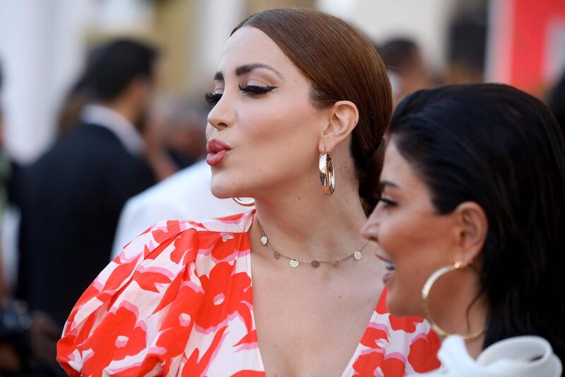 Syrian actress Nesreen Tafesh blows a kiss on the red carpet during the fourth El Gouna Film Festival on October 24, 2020. AFP