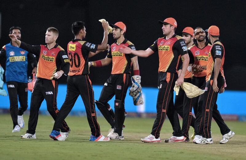 Sunrisers Hyderabad players celebrate the wicket of Rising Pune Supergiants batsman George Bailey. Noah Seelam / AFP