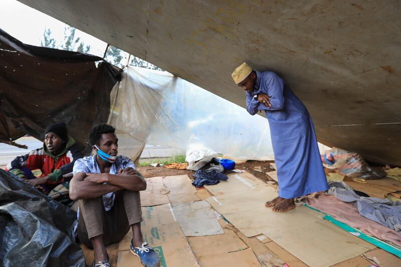 A Congolese refugee Muhamed Al-Ahadal (R), makes his evening prayers  under a footbridge where he and other refugees sleep next to a highway, ahead of World Refugee Day in Nairobi, Kenya . World Refugee Day is marked annually on 20 June to raise awareness of the situation of refugees around the world. According to the UNHCR, more and more refugees today live in urban settings outside refugee camps. EPA
