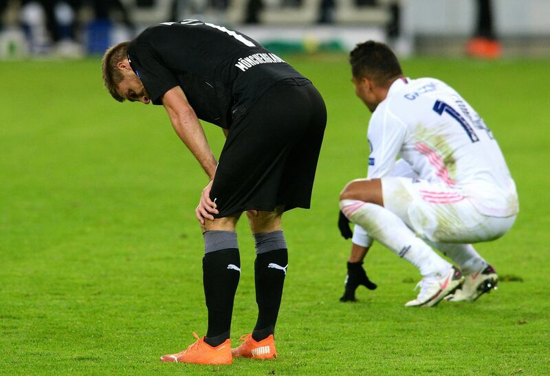 Moenchengladbach's Patrick Herrmann and Real Madrid's Casemiro look dejected after the match. Reuters