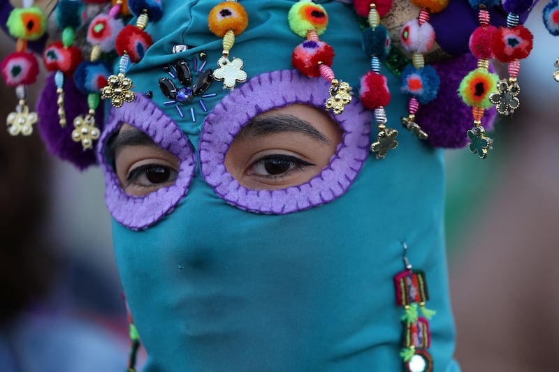 An activist performs the Chilean feminist protest anthem 'Un violador en tu camino', meaning 'A rapist in your path', in Santiago, Chile.  Reuters