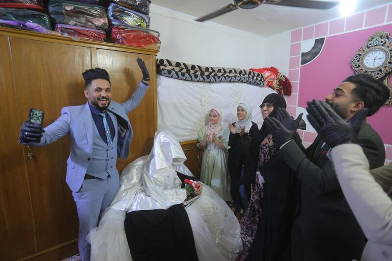 Ahmed Khaled Al Kaabi and his bride Ruqaya Rahim celebrate their wedding in Najaf, Iraq. AP Photo