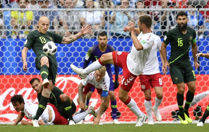 Australia's Aaron Mooy, left, clears a ball. Martin Meissner / AP Photo