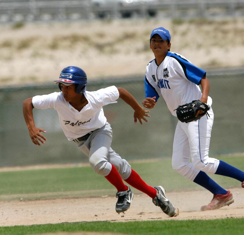 Dubai, UAE, April 24 2010- Dubai's Anthony Collins #3, steals third base in the 1st inning. Collins, also pitched for the Dubai Falcons.Dubai and Kuwait (ages 14-16)  matched up in the Championship game at the Dubai little league complex in Dubai.   Mike Young / The National