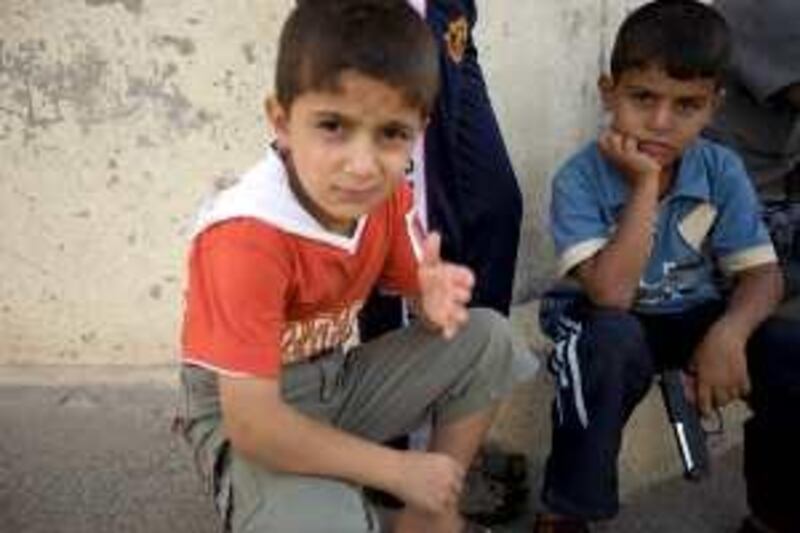 An Iraqi child with a plastic pistol on the streets of eastern Mosul, 21 September 2009. Children have been recruited by insurgent groups to attack US and Iraqi government forces, and community leaders have warned the practice is continuing.
