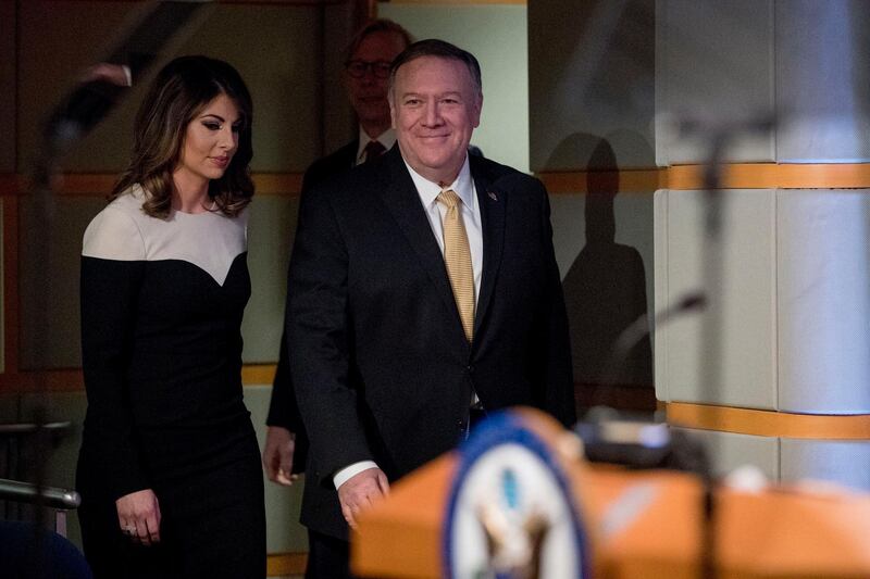 Secretary of State Mike Pompeo, right, accompanied by State Department spokeswoman Morgan Ortagus arrives for a news conference at the State Department in Washington. AP Photo