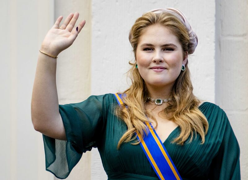 Crown Princess Amalia waves from a balcony of Noordeinde Palace in The Hague, the Netherlands. EPA