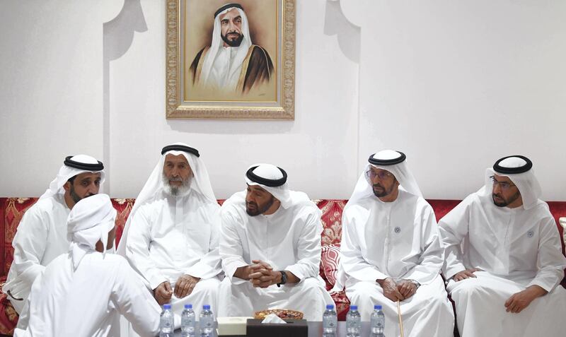 ABU DHABI, UNITED ARAB EMIRATES - July 02, 2018: HH Sheikh Mohamed bin Zayed Al Nahyan Crown Prince of Abu Dhabi Deputy Supreme Commander of the UAE Armed Forces (3rd R) offers condolences to the family of the late Mubarak bin Garran Al Mansouri. Seen with HE Hamad bin Suhail Al Khaili (2nd R) and HH Sheikh Hamdan bin Zayed Al Nahyan, Ruler’s Representative in Al Dhafra Region (R).

( Abdullah Al Junaibi )
---