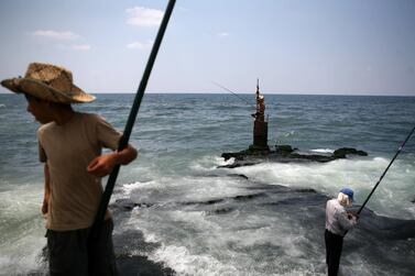 A Lebanese fisherman loosk out across the Mediterranean Sea. Lebanon and Israel are locked in a long-running maritime border dispute. Nicole Hill / The National