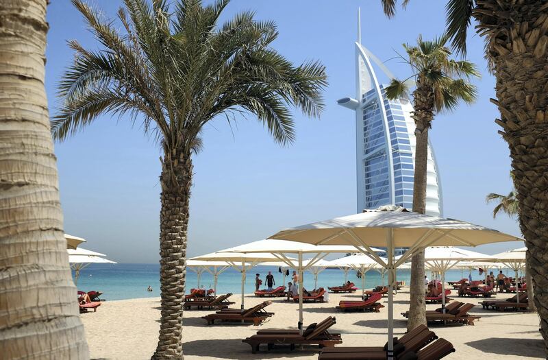 A picture taken on May 14, 2015 shows a view of Dubai's Burj al-Arab hotel seen from the Mina al-Salam beach hotel and touristic resort in Jumeirah. AFP PHOTO / PATRICK BAZ / AFP PHOTO / PATRICK BAZ