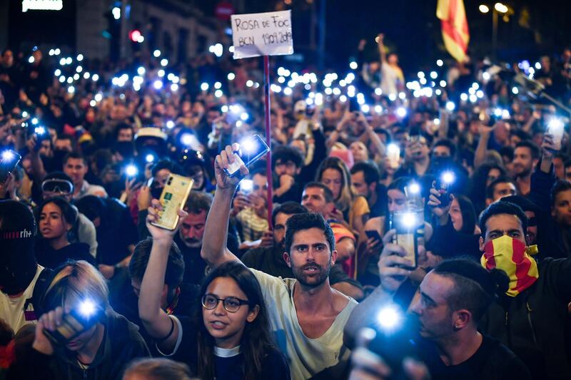 BARCELONA, SPAIN - OCTOBER 19: Demonstrators hold up their phones following a week of protests over the jail sentences given to separatist politicians by Spains Supreme Court, on October 19, 2019 in Barcelona, Spain. Disturbances followed a week of protests over the jail sentences given to separatist politicians by Spain's Supreme Court. Nine Catalan pro-independence leaders were sentenced to varying jail terms for sedition, in relation to the 2017 independence referendum. (Photo by Jeff J Mitchell/Getty Images)
