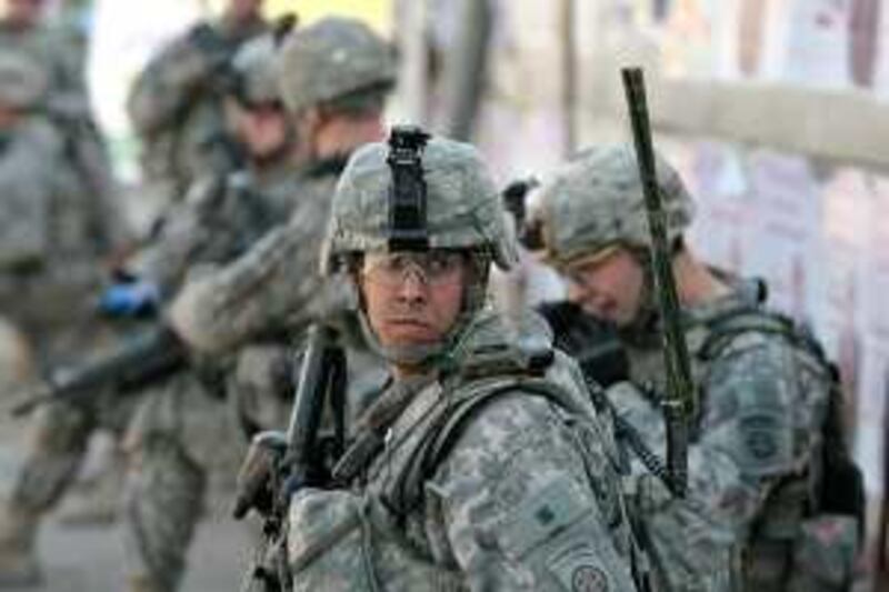 US soldiers are seen during a patrol in the fashionable Karrada district of Baghdad on February 25 2009. All US combat troops will leave Iraq by August next year and a full withdrawal will be completed by the end of 2011 under a strategy to be laid out by President Barack Obama, top officials said. There are currently about 142,000 US troops in Iraq but the conflict -- in which more than 4,250 US troops have died -- has deeply divided the US public and badly hit the United States' international standing.  AFP PHOTO / AHMAD AL-RUBAYE *** Local Caption ***  DV477820.jpg