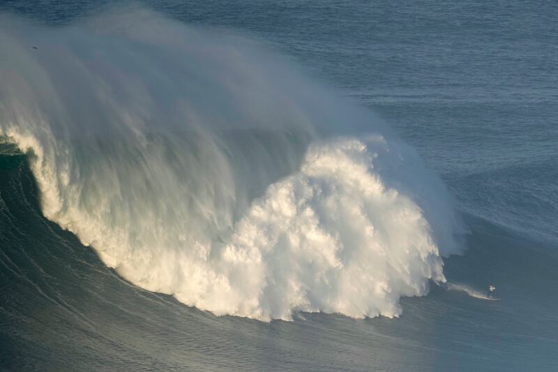 A surfer during a big wave surfing session at Praia do Norte, or North Beach, in Nazare, Portugal, on Saturday, January 8. AP