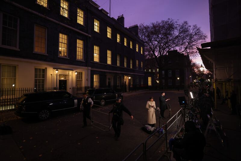 News reporters broadcasting from Downing Street in the early hours. Bloomberg