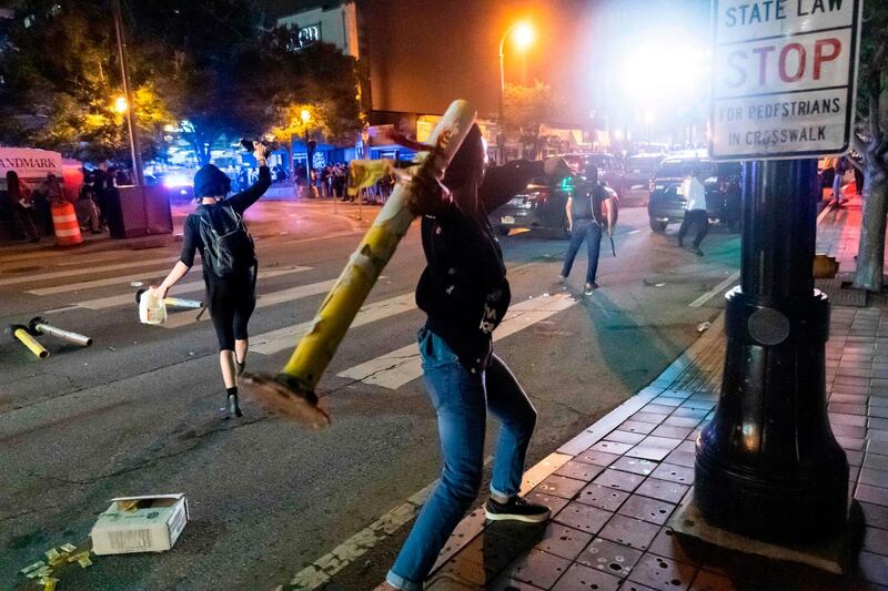 Protesters face off with police during rioting and protests in Atlanta.  AFP