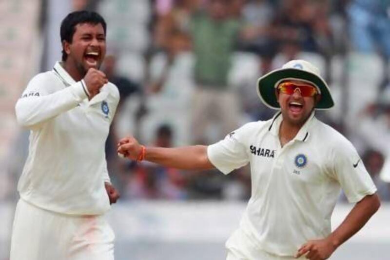 Suresh Raina, right, last played in a Test series against New Zealand last year. Mahesh Kumar A / AP Photo
