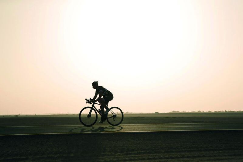 Sports fan Emma Woodcock, at the Al Qudra track near Bab Al Shams, cycles year round, even through the summer months. Antonie Robertson / The National