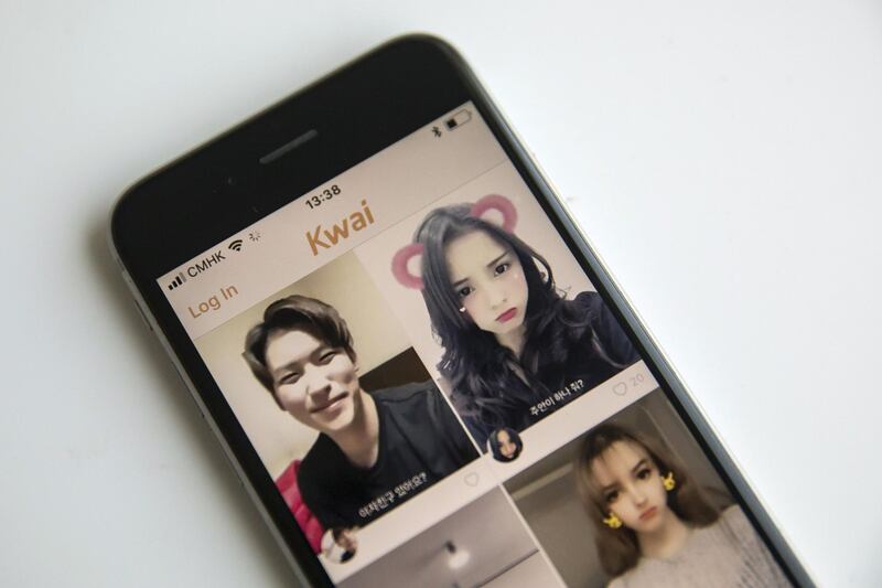 Beijing Kwai Technology Co.'s app Kuaishou, or Kwai, is arranged for a photograph on a smartphone in Hong Kong, China, on Tuesday, Jan. 16, 2018. Tencent-backed Chinese startup Kuaishou is seeking to raise funds at about a $17 billion valuation, people familiar with the matter said, as it expands its video-streaming service to Southeast Asia. Photographer: Qilai Shen/Bloomberg