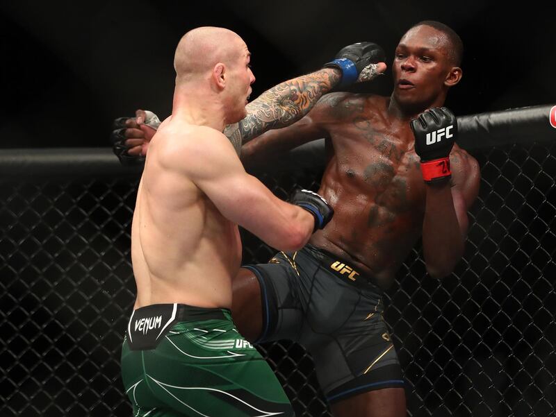 Marvin Vettori moves in with a hit as Israel Adesanya defends.